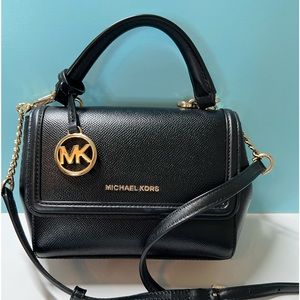 MK messenger bag, used once, near perfect condition.